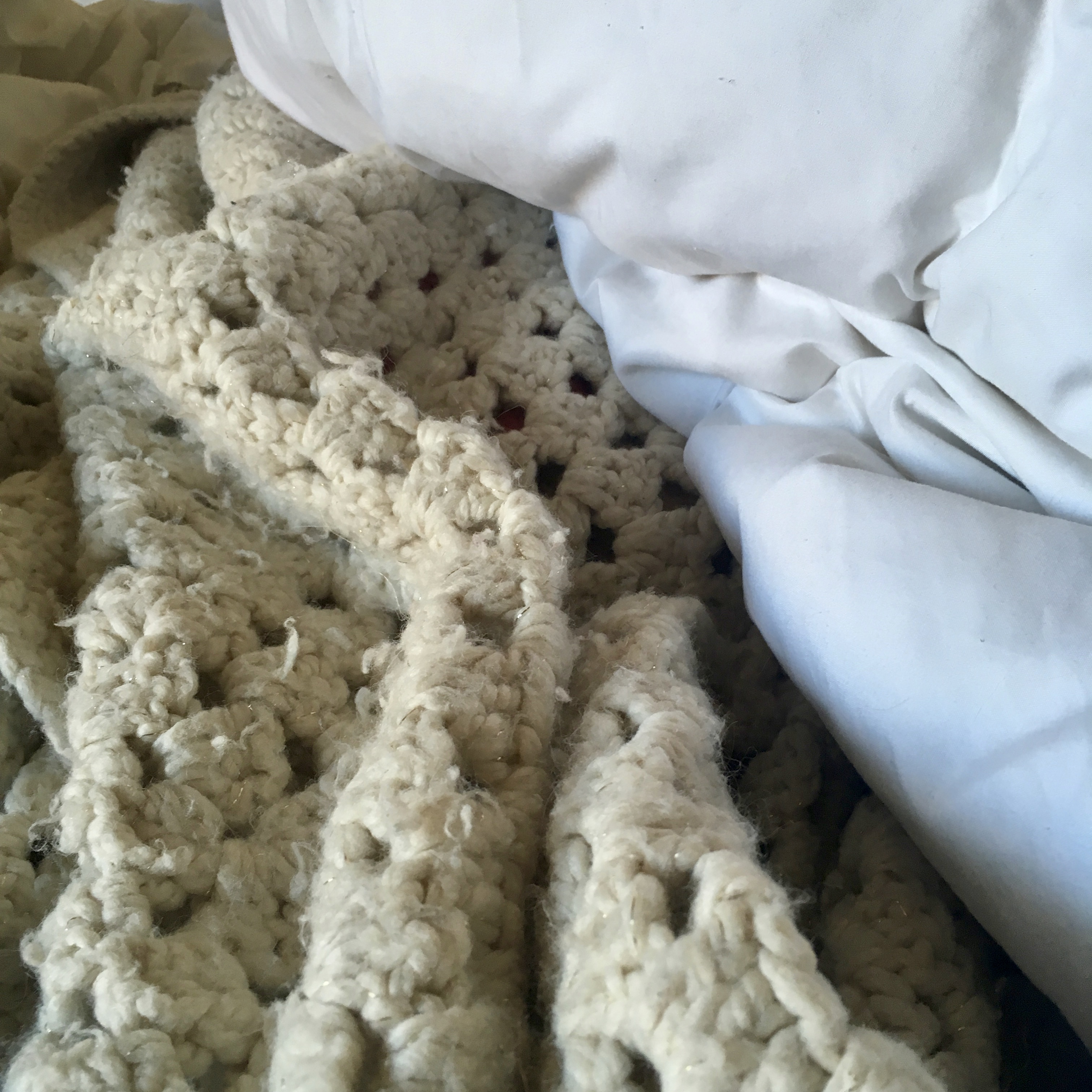 A rumpled, unmade bed.